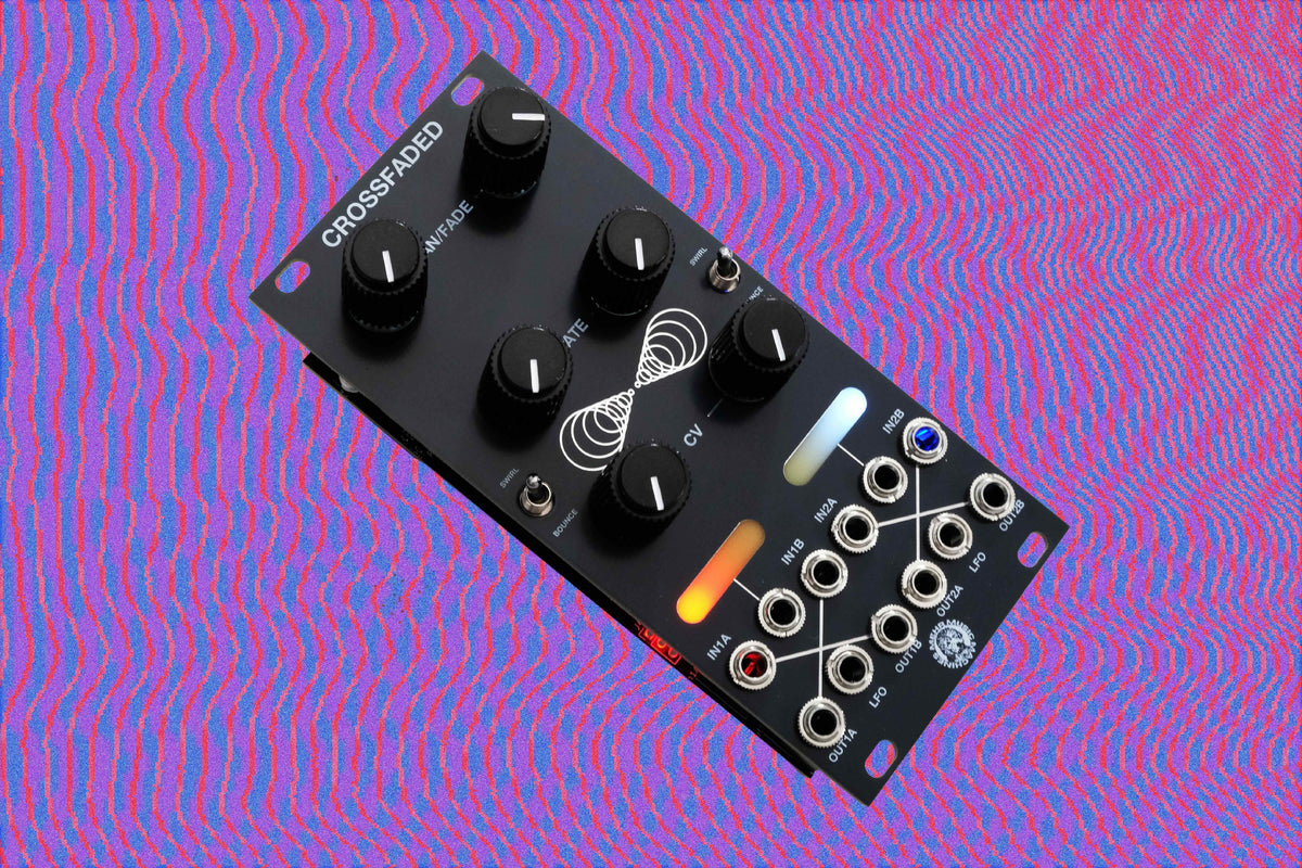 A black modular electronic synthesizer patch bay or crossover pedal labeled 'CROSSED OVER' at an angle, featuring multiple black rotary knobs, white printed markings, and illuminated orange and blue LED indicators, set against a vibrant pink and purple wavy patterned background.